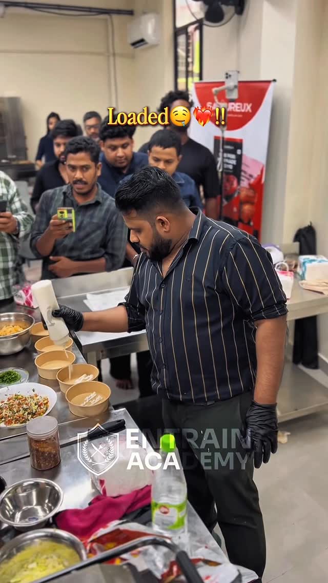 Students preparing loaded fries during a hands-on workshop
