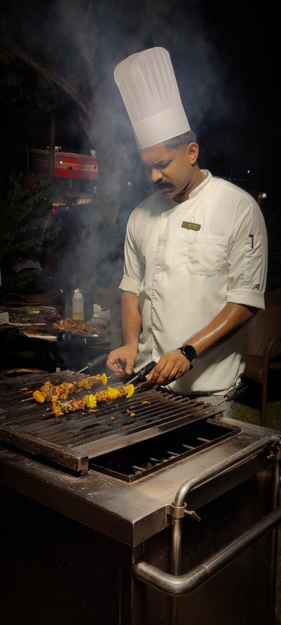 Chef Akhil preparing barbecue dishes at the grill