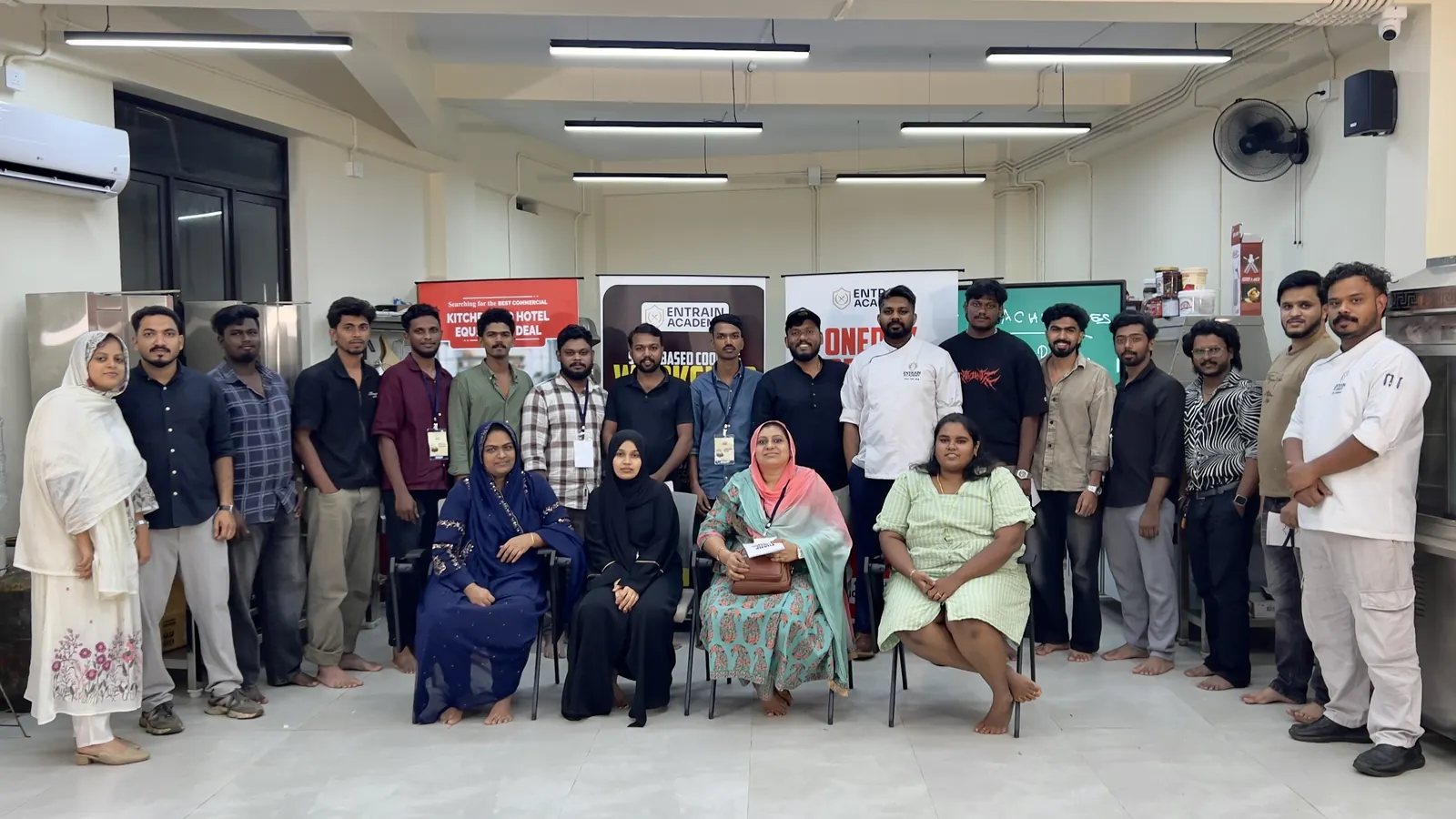 Culinary students and trainers in the academy classroom
